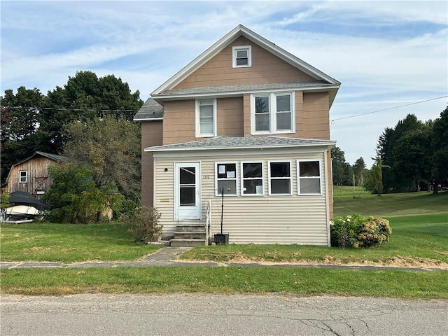 front facade with a front lawn