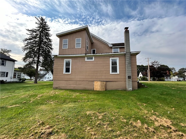 view of property exterior featuring a lawn