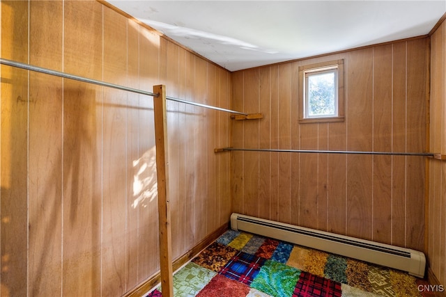 spacious closet with a baseboard heating unit