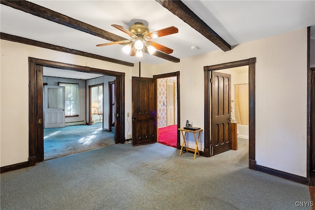 unfurnished bedroom featuring a baseboard heating unit, carpet, ceiling fan, and beamed ceiling