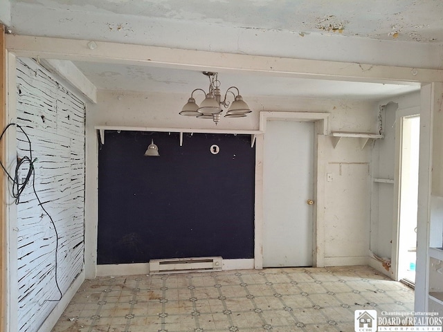 interior space with a notable chandelier and baseboard heating