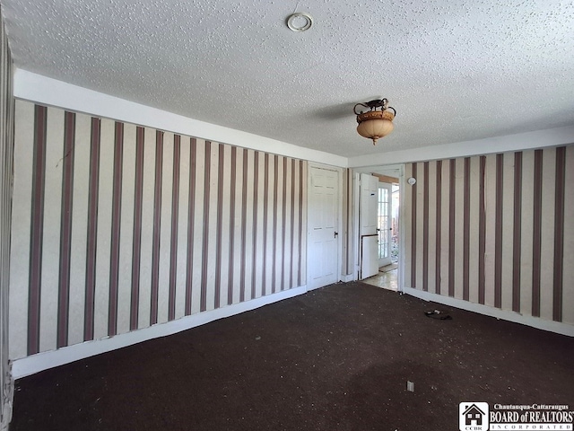 spare room featuring a textured ceiling