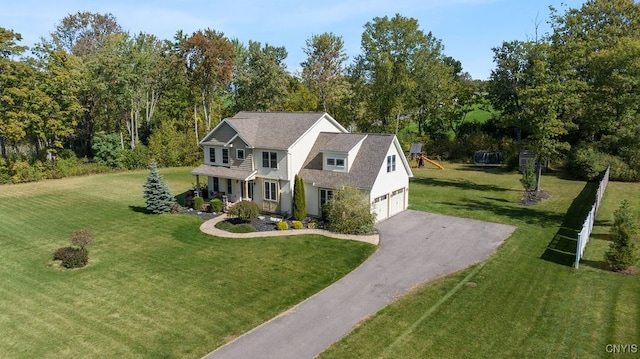 view of front of house with a front lawn and a garage