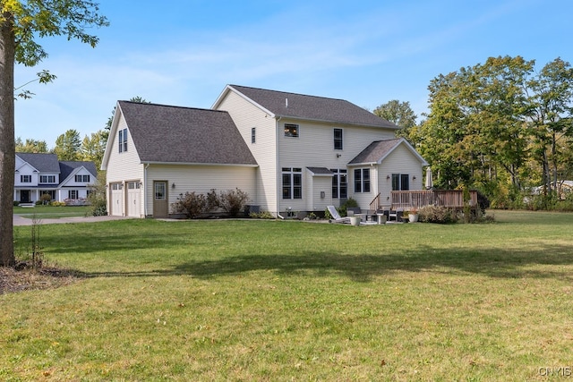 back of house with a yard and a wooden deck