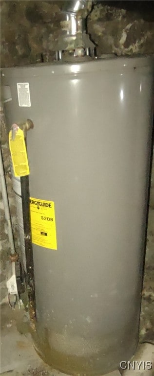 utility room featuring water heater