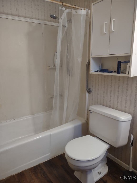 bathroom with shower / bath combo, hardwood / wood-style flooring, and toilet