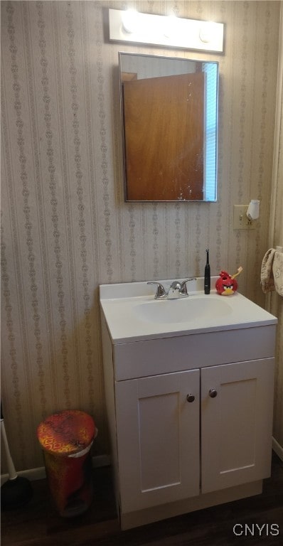 bathroom with vanity and hardwood / wood-style floors