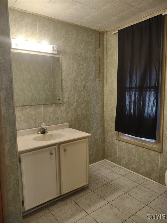 bathroom with tile patterned floors and vanity