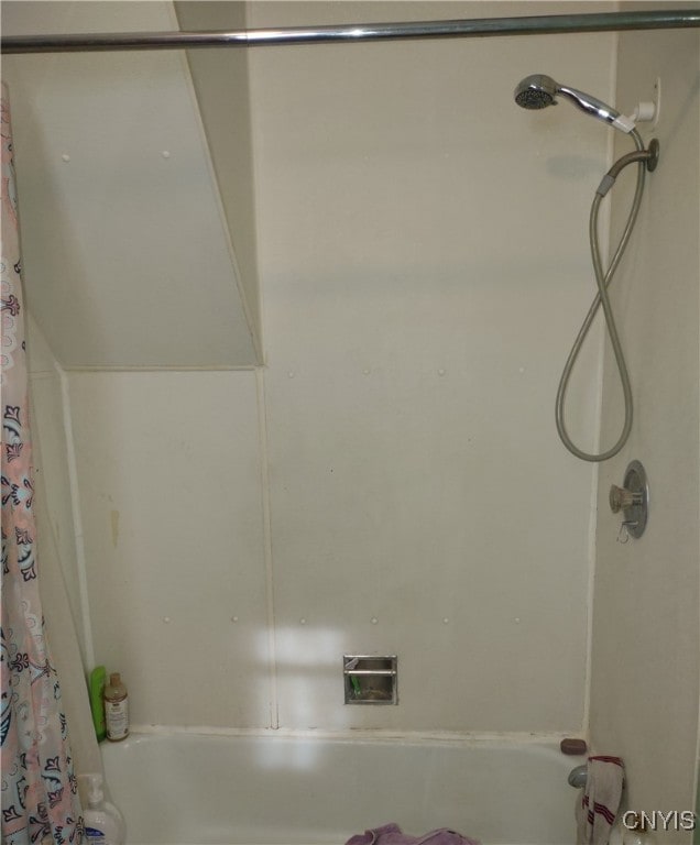 bathroom featuring shower / bath combination with curtain