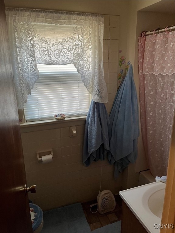 bathroom with vanity and a shower with shower curtain