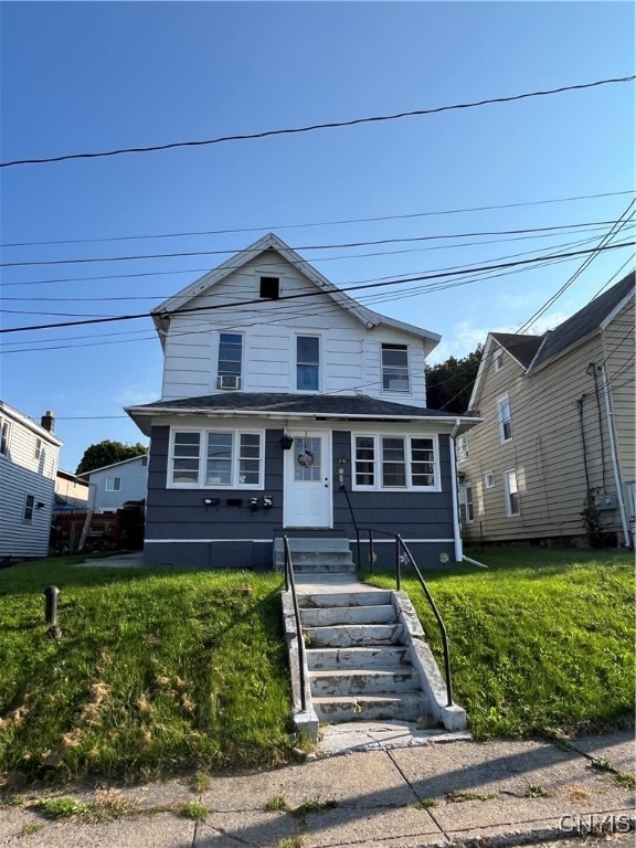 view of front of home with a front lawn