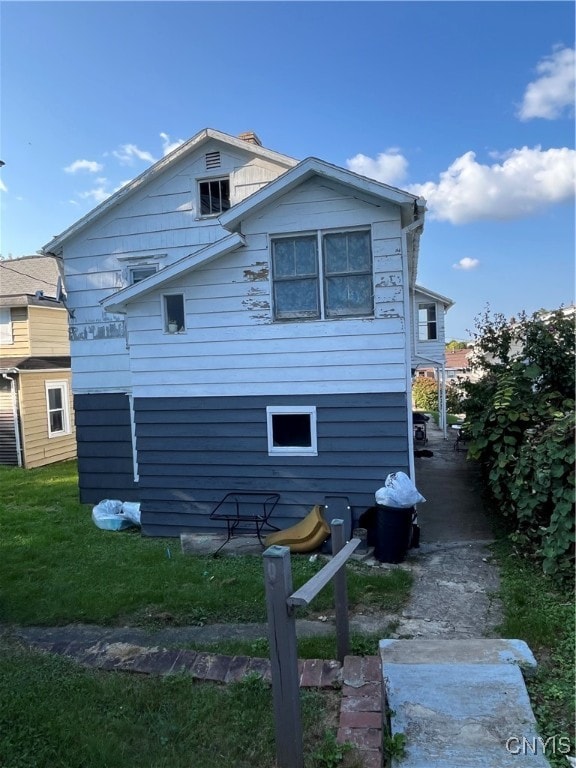 view of property exterior featuring a yard