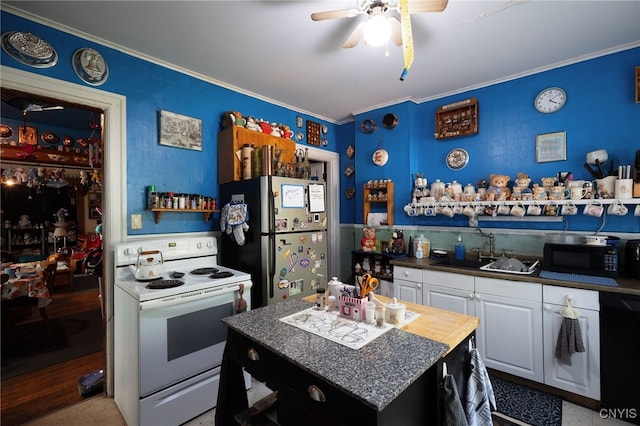 kitchen with white cabinetry, a center island, sink, white appliances, and ornamental molding