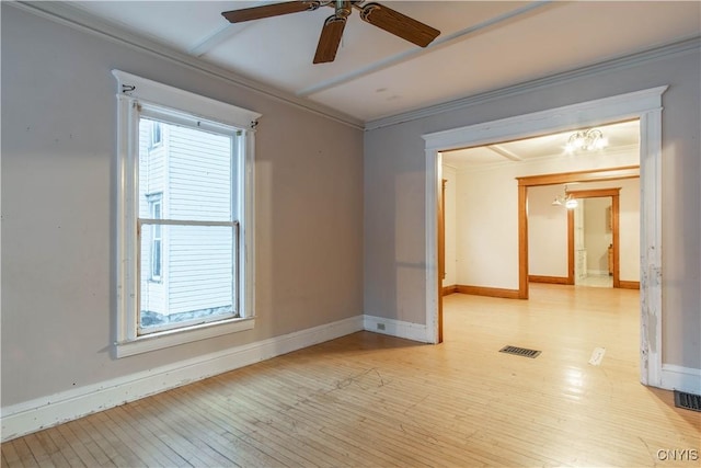 empty room with ceiling fan, light wood-type flooring, and ornamental molding