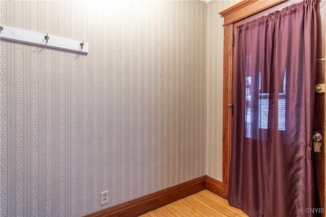 mudroom with wood-type flooring