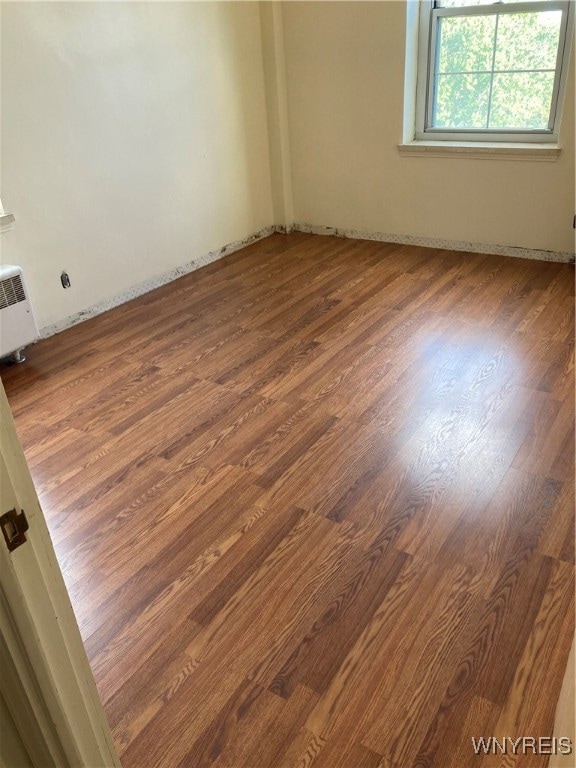 empty room featuring hardwood / wood-style flooring