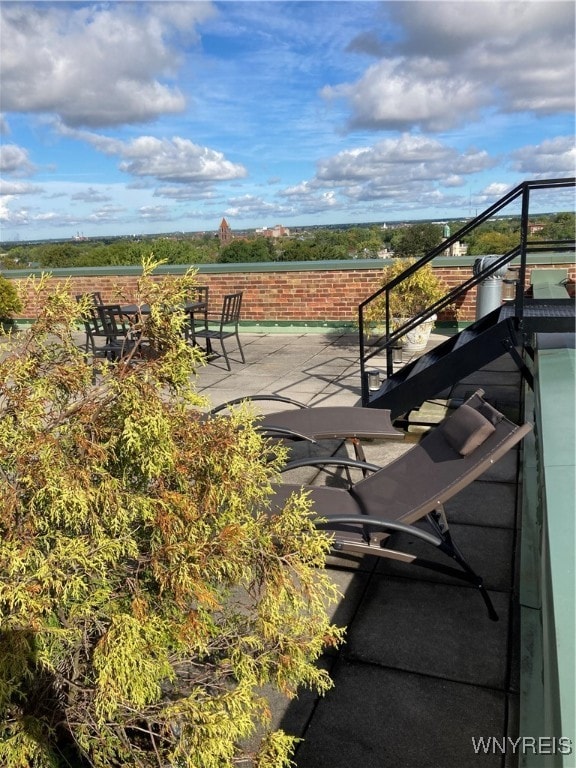 view of patio with a balcony