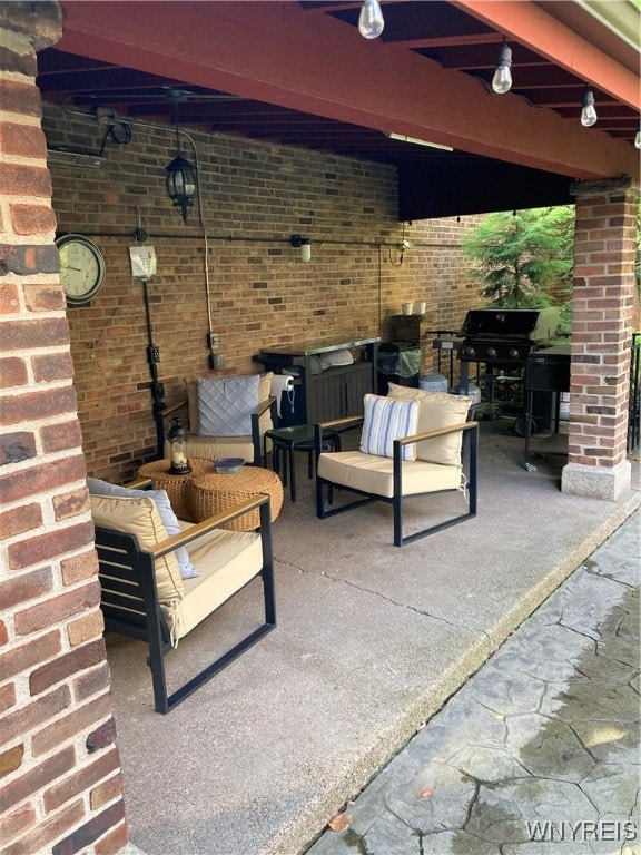 view of patio / terrace featuring ceiling fan