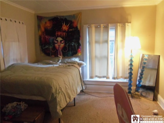 bedroom featuring ornamental molding and carpet flooring