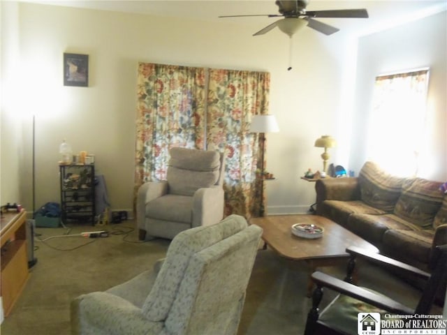 living room featuring carpet flooring and ceiling fan