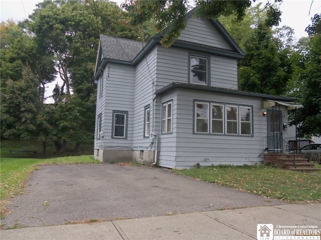 view of home's exterior featuring a yard