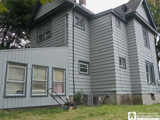 view of home's exterior with central AC