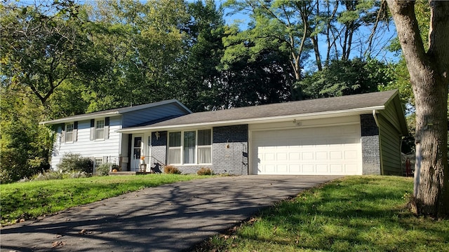 split level home with a garage and a front lawn