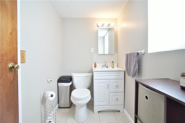 bathroom featuring tile patterned flooring, vanity, and toilet