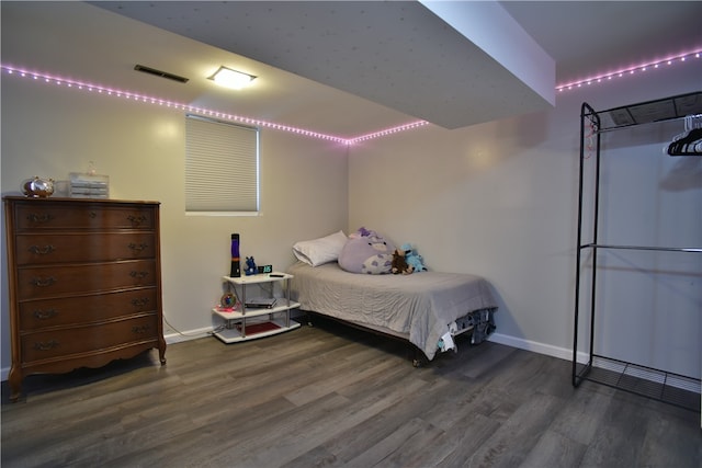 bedroom featuring dark hardwood / wood-style flooring