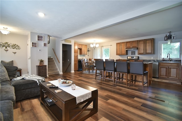 living room featuring dark hardwood / wood-style floors and a wealth of natural light