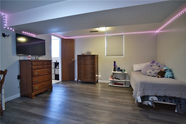 bedroom featuring dark hardwood / wood-style flooring