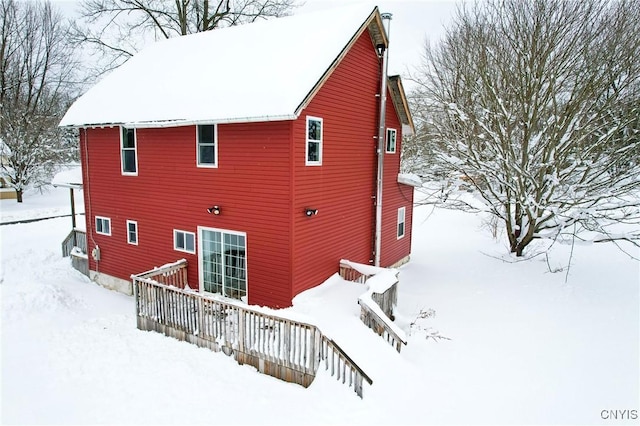 view of snow covered house