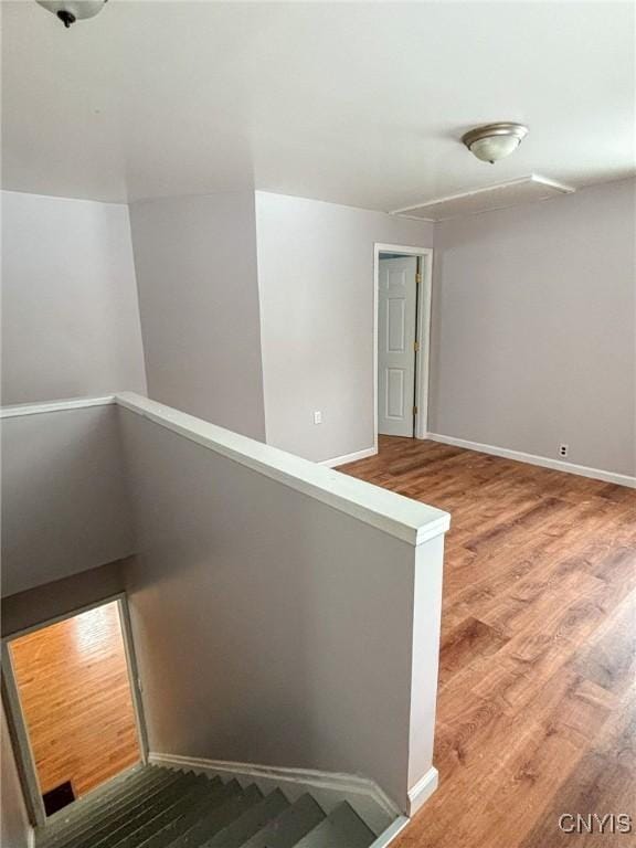 stairway featuring hardwood / wood-style flooring