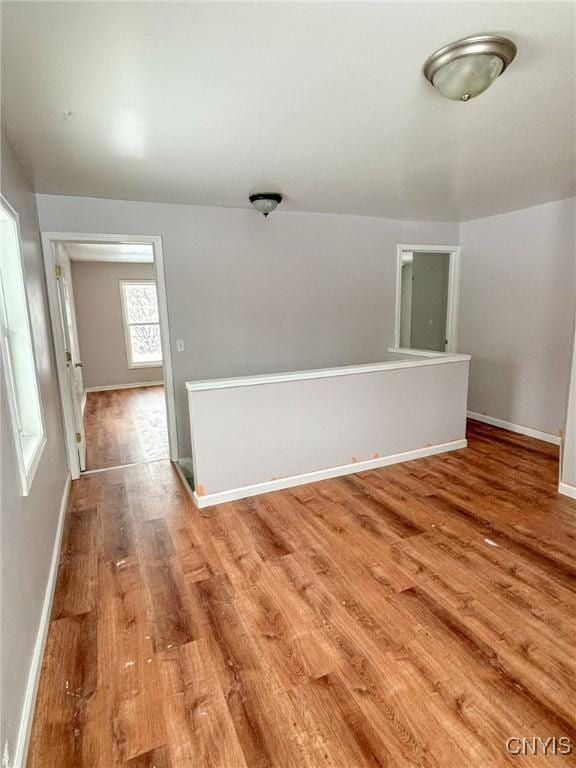 spare room with hardwood / wood-style floors