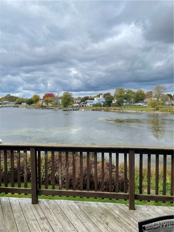 wooden deck with a water view