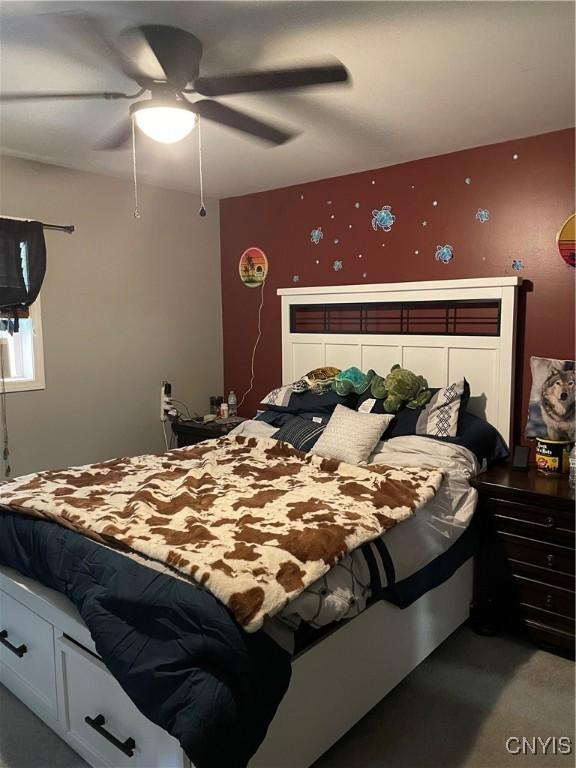 28541 Hewitt Dr, Lyme, NY 13622 - carpeted bedroom with ceiling fan