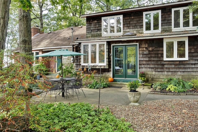 back of house with a patio area and french doors