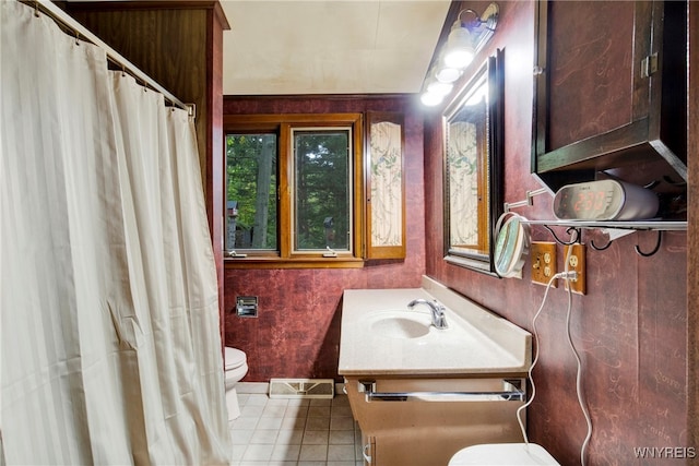 bathroom with tile patterned floors, vanity, and toilet