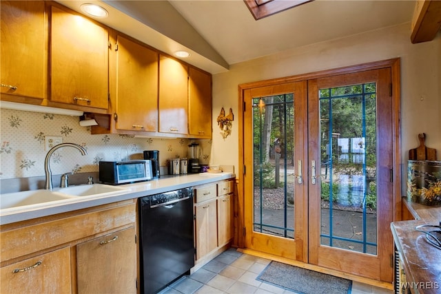 kitchen featuring lofted ceiling, french doors, sink, decorative backsplash, and black dishwasher