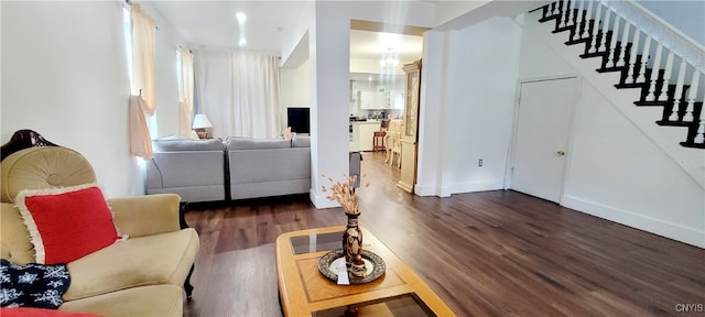 living room featuring dark wood-type flooring