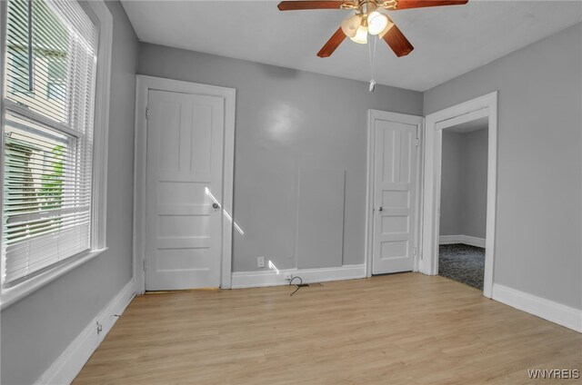 unfurnished room featuring light hardwood / wood-style floors and ceiling fan