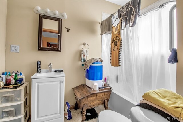 full bathroom with tile patterned flooring, shower / bathtub combination with curtain, toilet, and vanity