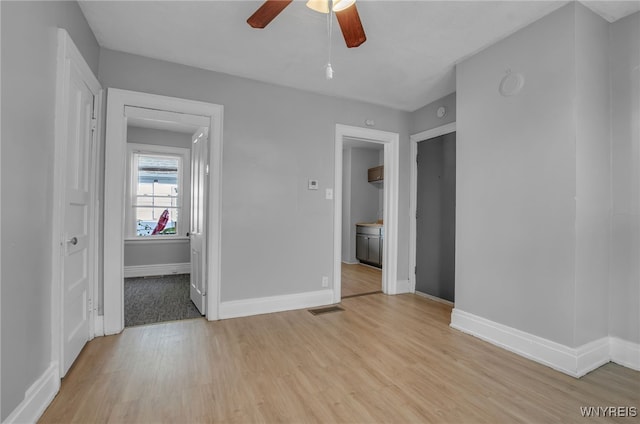 interior space with ceiling fan and light wood-type flooring