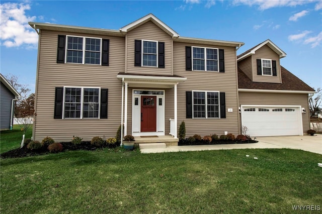 view of front of home featuring a front yard and a garage