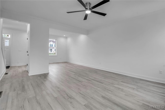 empty room featuring ceiling fan and light hardwood / wood-style floors