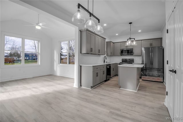 kitchen with pendant lighting, a center island, gray cabinetry, and black appliances