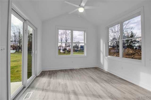 unfurnished sunroom featuring ceiling fan and lofted ceiling