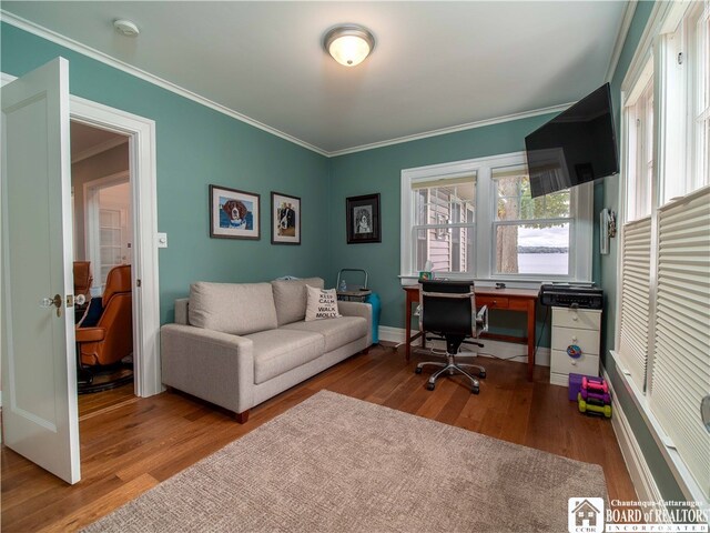 office area with ornamental molding, baseboards, and wood finished floors