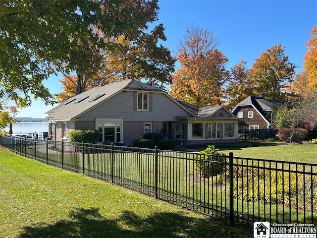 view of front of property featuring fence private yard and a front yard