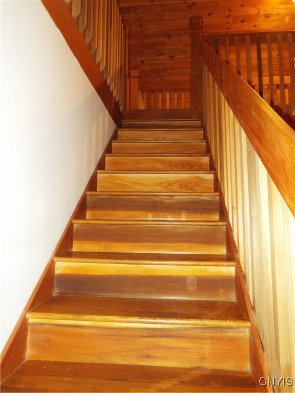 staircase featuring hardwood / wood-style flooring